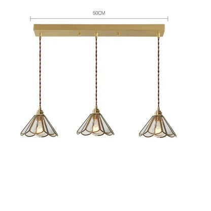 Modern brass glass copper led pendant lights with gold-toned bell-shaped glass shades and twisted copper cords for dining room