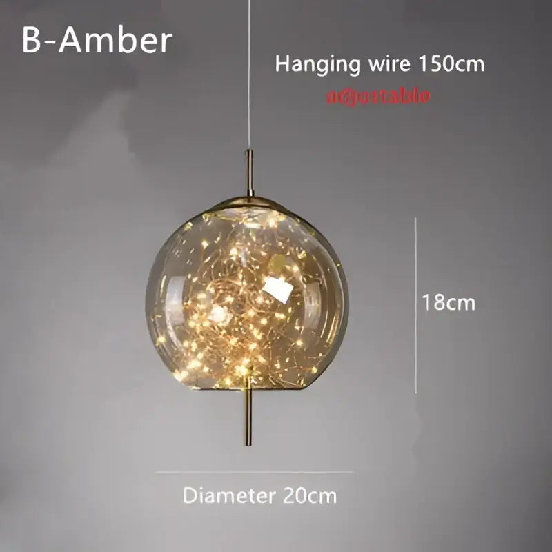 Modern brass glass cord pendant light with spherical amber globe and warm fairy lights suspended by adjustable brass wire