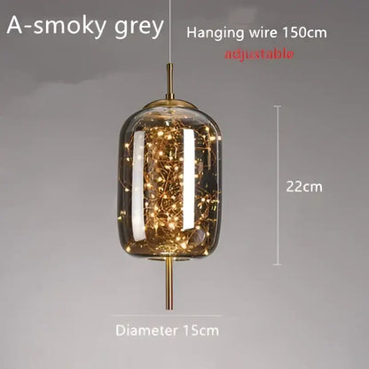 Modern brass glass cord pendant light with smoky grey glass, gold metal accents, warm fairy lights, ideal for dining room