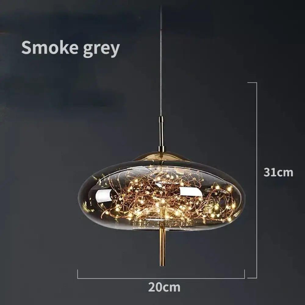 Modern brass glass pendant light featuring smoke grey glass pendant with golden filament strings for bedroom chandelier