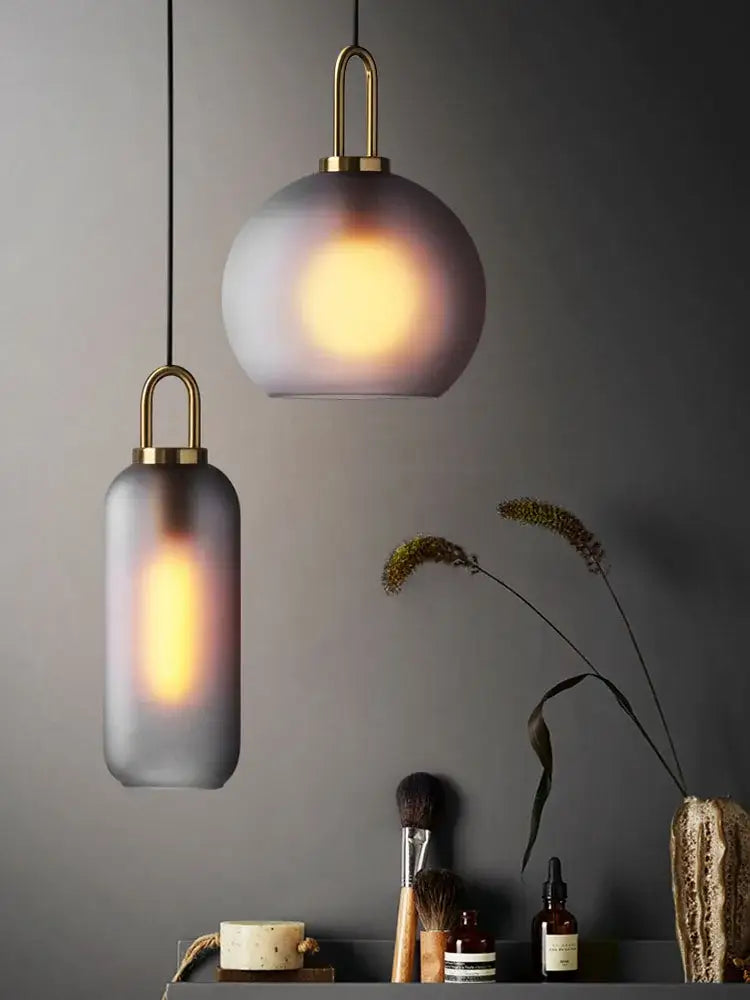 Modern brass glass staircase chandelier featuring two pendant lights with frosted glass shades for living room