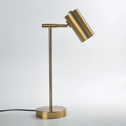 Brass-finished adjustable table lamp with cylindrical shade and slender stem for modern decorbites golden table lamp decor