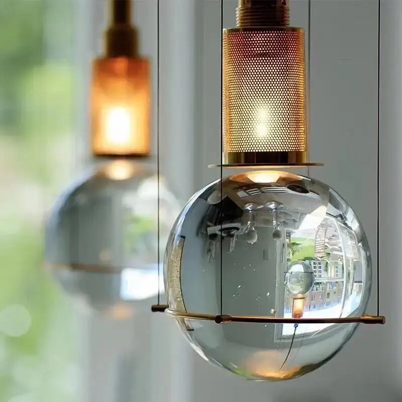Modern brass honeycomb crystal ball led pendant light with spherical glass and brass mesh top for dining room decorbites decor