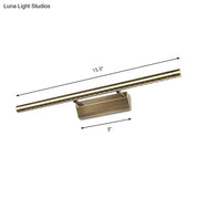 Modern brass led wall mounted light fixture with brass finish, rectangular base, and embedded bulbs for bathroom vanity lighting