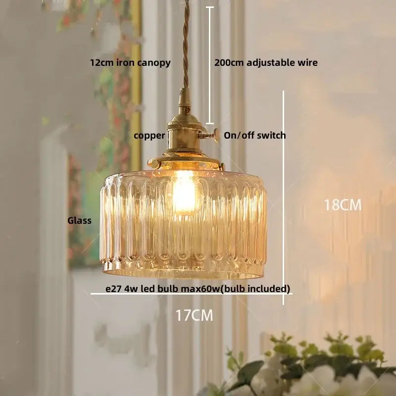 Modern brass ribbed clear glass pendant lamp with warm-toned glass and adjustable wire suspension for dining room decorbites clear glass