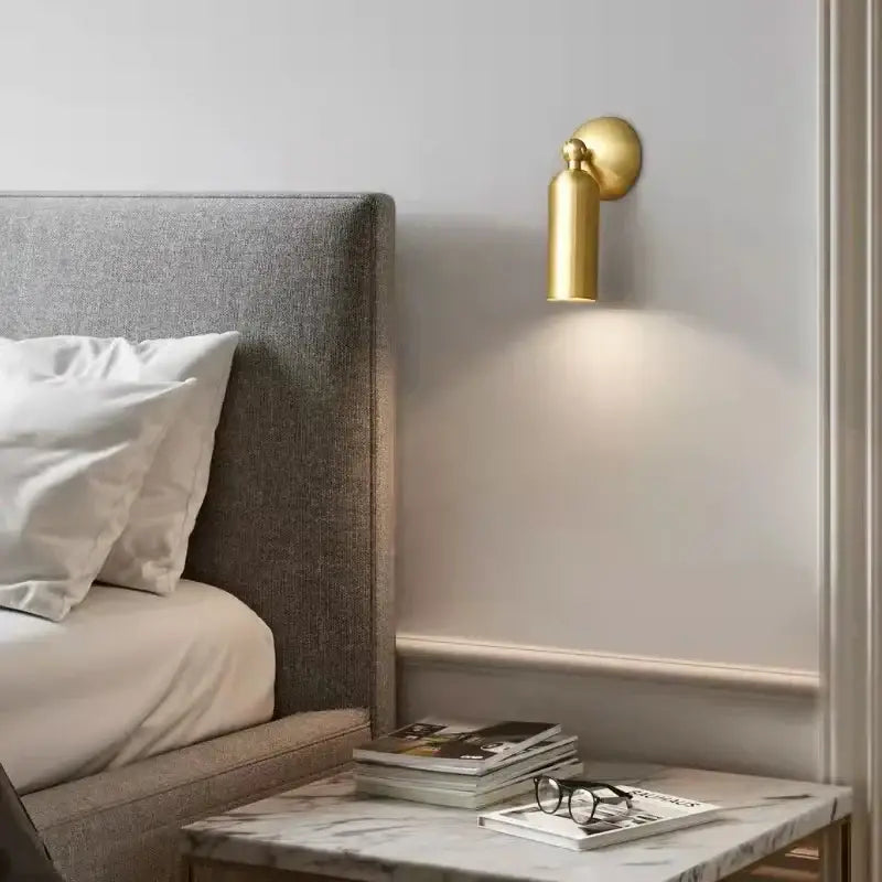 Modern brass rotatable led wall sconces with gold-toned cylindrical design for bedroom decor by decorbites brass rotatable