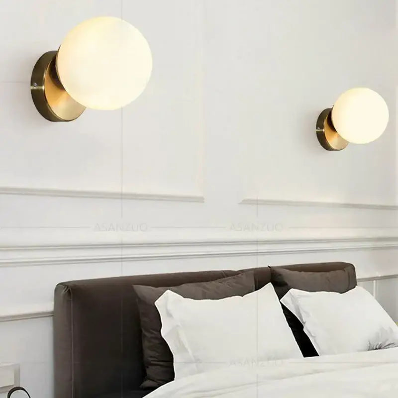 Modern brass round ceiling lamp with gold-finished spherical sconces and frosted glass round globes for hallway lighting