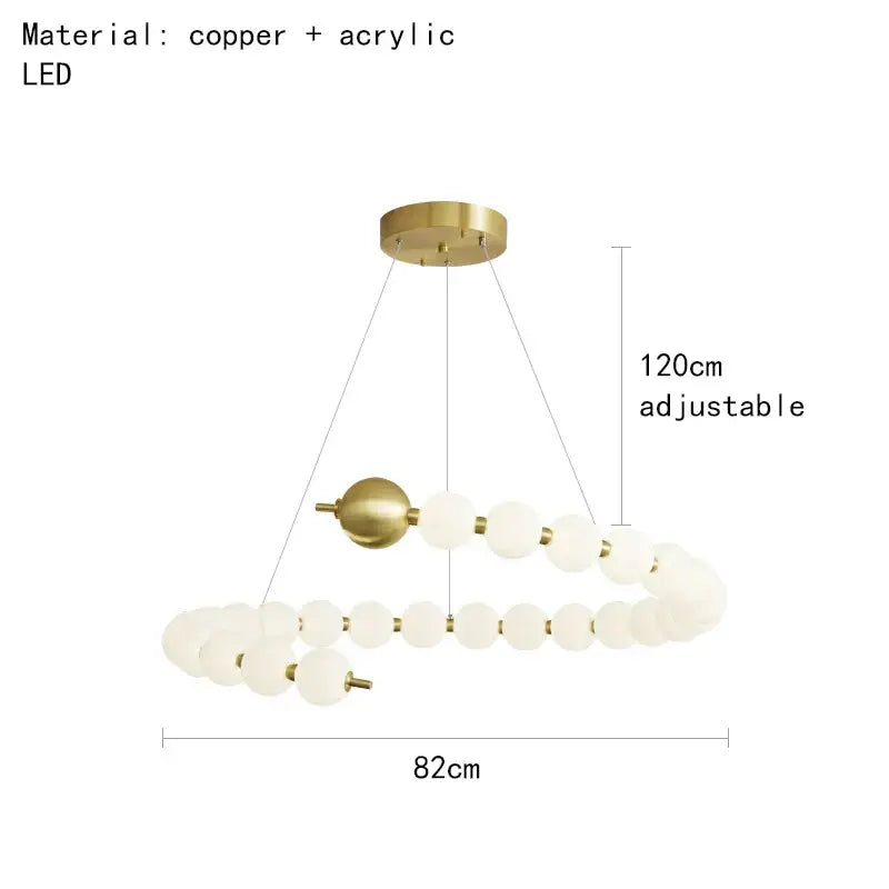 Modern brass round led pendant lights featuring gold-toned copper and acrylic spherical design with adjustable height