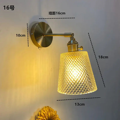 Modern brass wall sconce with ruffled clear glass led shade featuring a textured golden-yellow decorbites clear glass design