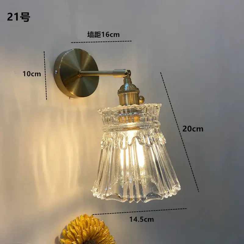 Modern brass ruffled clear glass led wall sconce with clear fluted glass and brass-finished metal arm decorbites clear glass