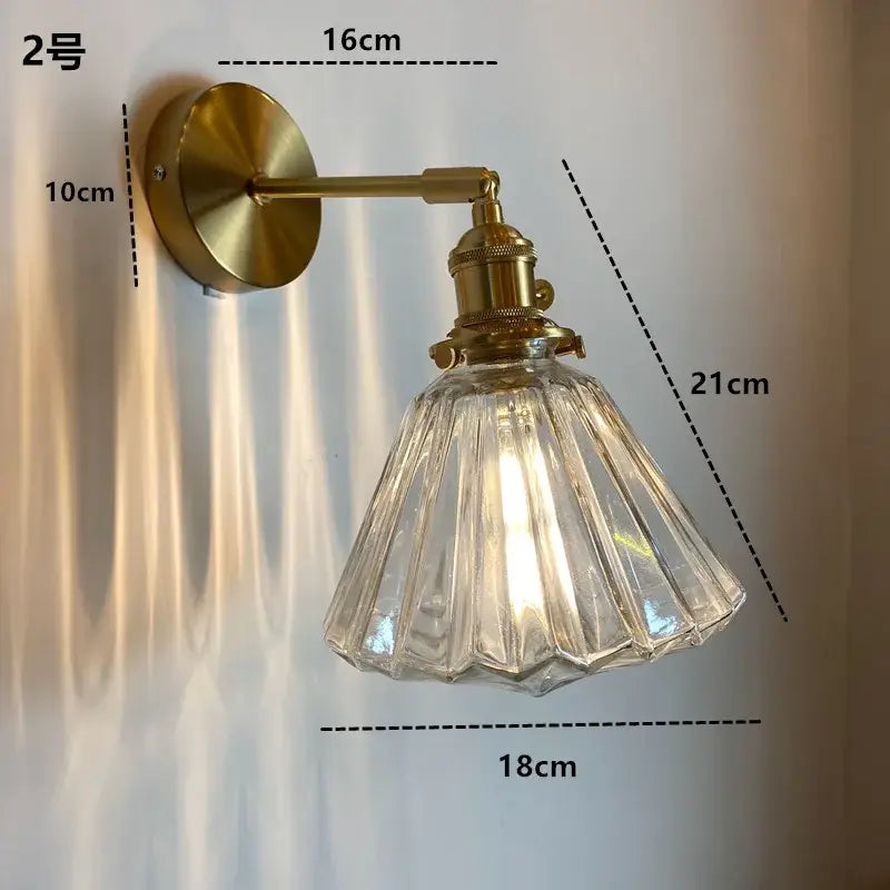 Modern brass wall sconce with ruffled clear glass led shade by decorbites for bathroom lighting