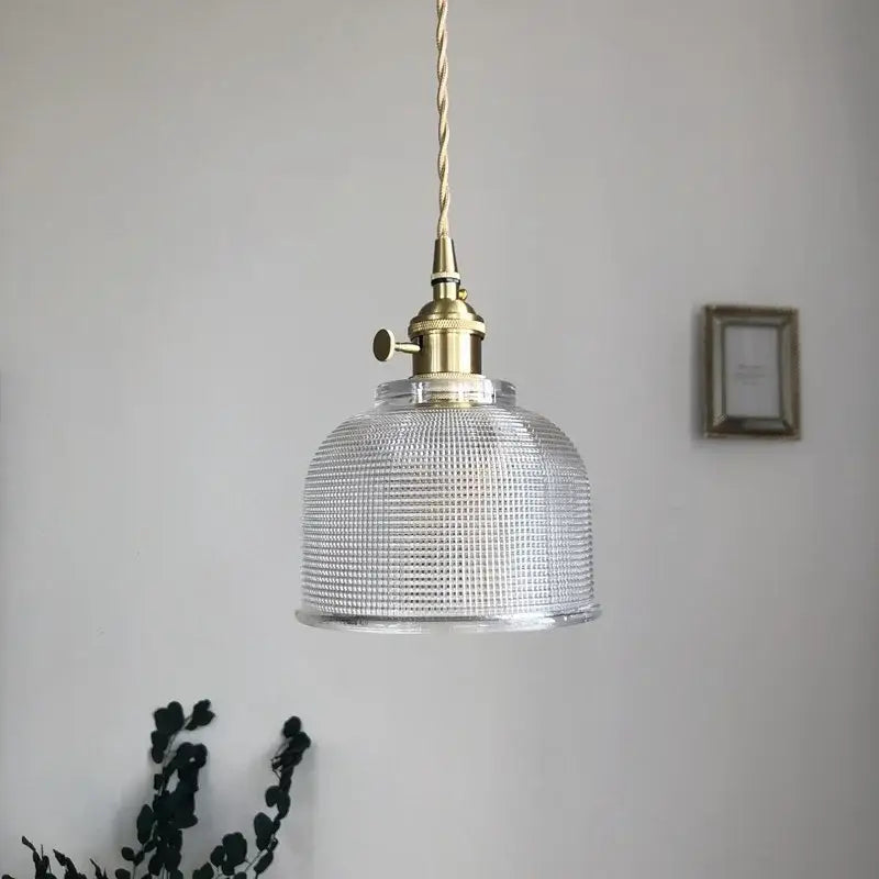 Modern brass textured glass led pendant light featuring a clear grid-patterned glass shade and brass hardware