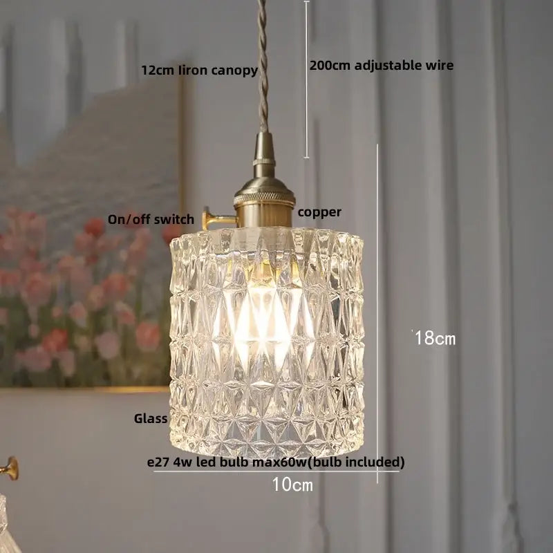 Modern brass textured glass led pendant light featuring a clear faceted glass led pendant with brass hardware