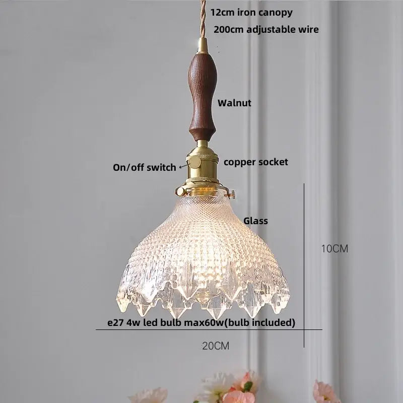 A modern brass textured glass led pendant light with walnut iron canopy for kitchen use