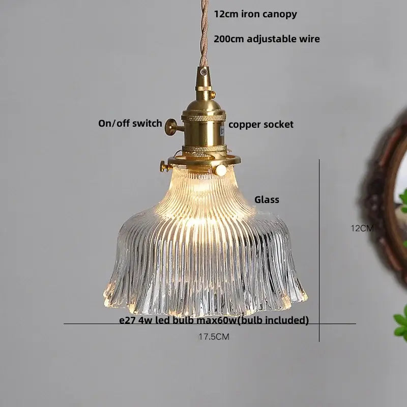 A modern brass textured glass led pendant light with a clear ribbed shade ideal for kitchen use