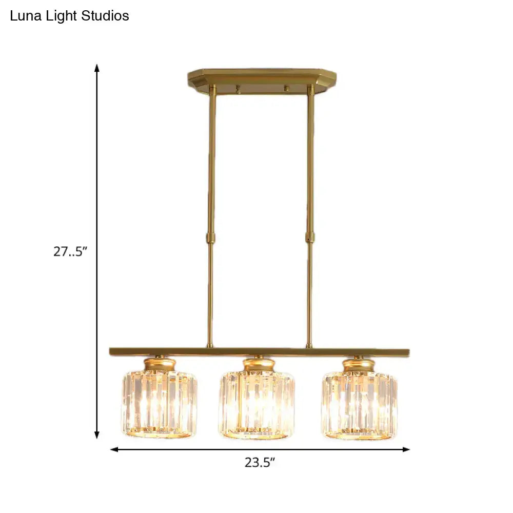 Gold-finished brass ceiling pendant with three crystal glass shades and adjustable chain cord length for dining room use