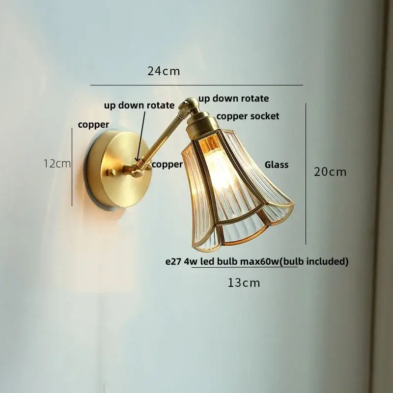 Modern brass wall lamp with an adjustable brass finish and fluted clear glass shade for bedroom reading light decorbites clear glass