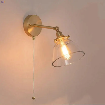 Modern brass wall lamp with clear glass shade and exposed filament bulb for bedroom reading decorbites clear glass design