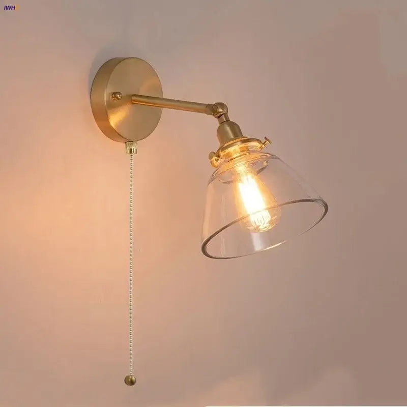 Modern brass wall lamp with clear glass shade and exposed filament bulb for bedroom reading decorbites clear glass design