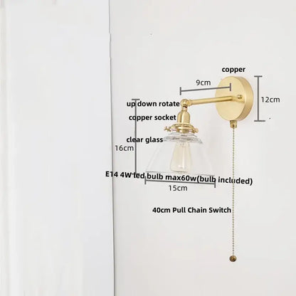 Modern brass wall lamp with clear glass shade and brass-finished copper design for bedroom reading light decorbites clear glass