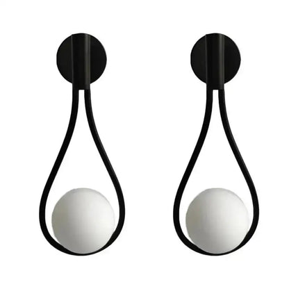 Modern brass wall sconce with black teardrop metal frame and frosted glass bulbs for stylish living room decorbites brass wall sconce