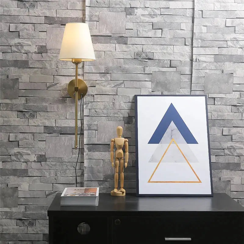Modern brass wall sconce with cream-colored lampshade featuring decorbites gold touch led for elegant dining room decor