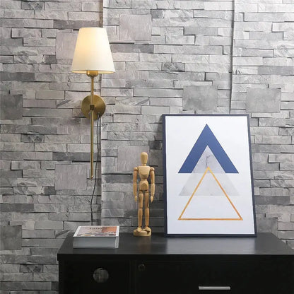 Modern brass wall sconce with cream-colored lampshade featuring decorbites gold touch led for elegant dining room decor