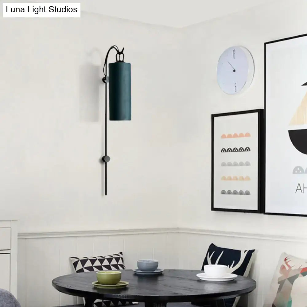 Dark teal cylindrical wall sconce with black metal arm and base direct wired electric 220v-240v for living room use