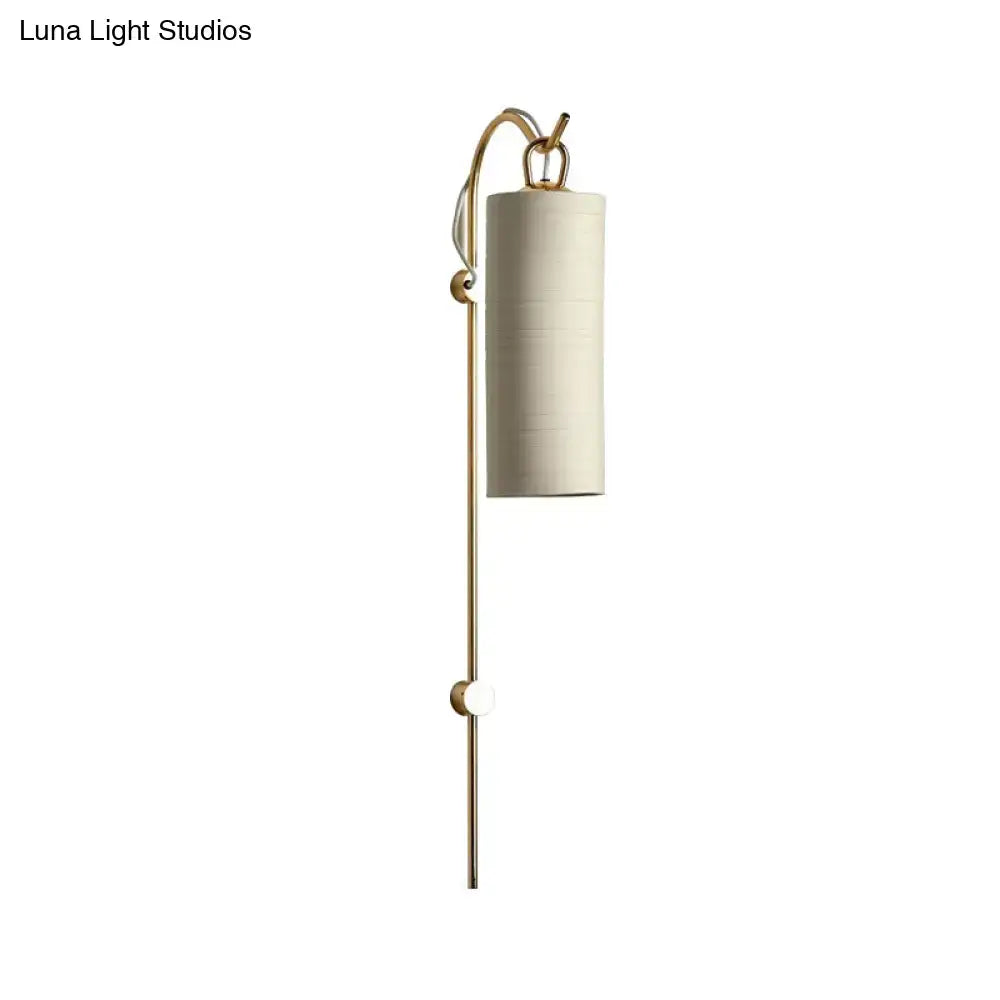 Modern brass and white wall sconce with slender frame and fabric shade direct wired electric 220v-240v for living room