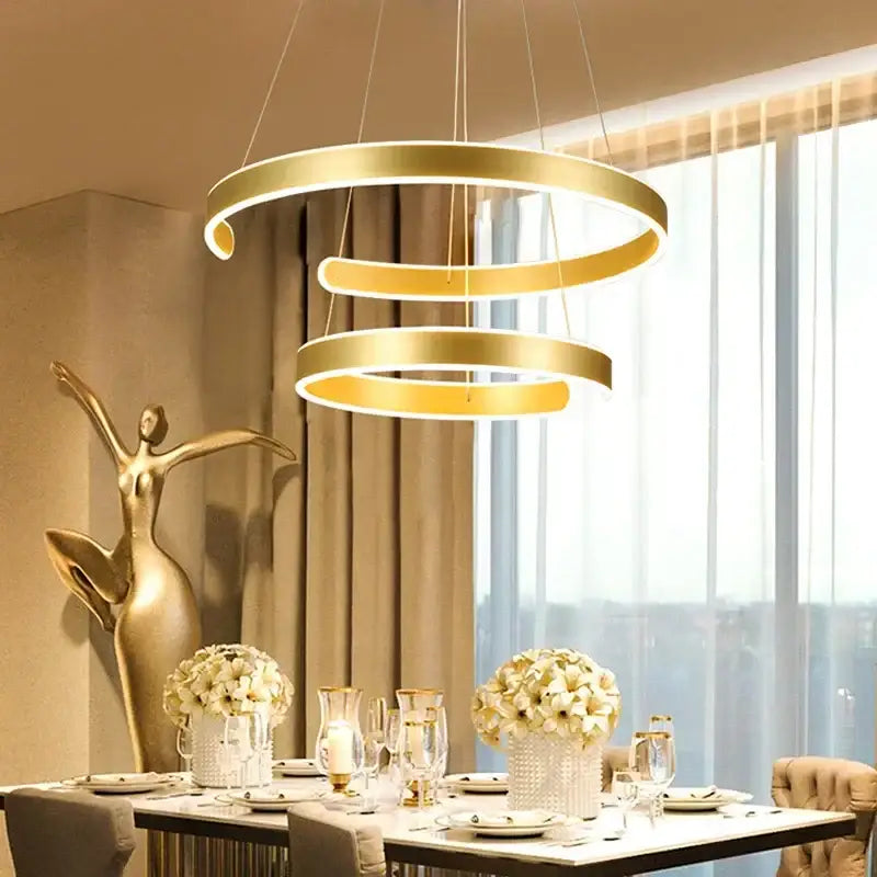 Modern bronze circle rings acrylic pendant light with gold-toned spiral rings and integrated led lighting for dining room decorbites circle rings