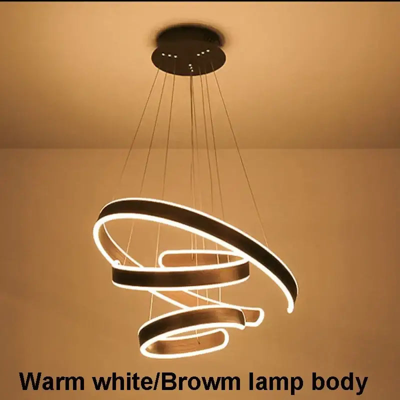 Modern pendant light with warm white led circle rings and brown acrylic body ideal for dining room decorbites circle rings