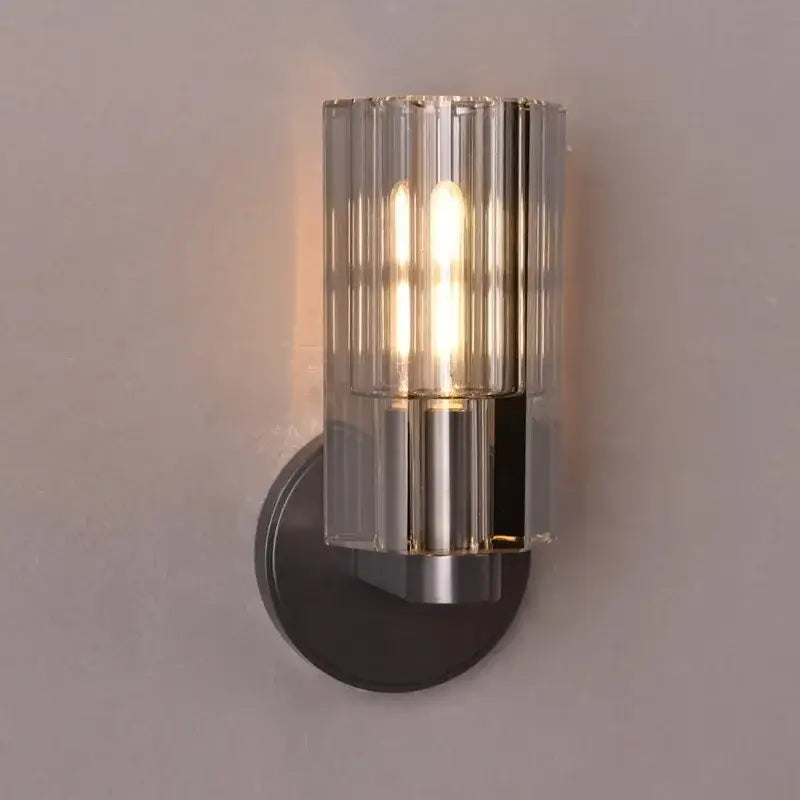 Modern bronze copper crystal wall lamp with a cylindrical ridged glass shade and brushed metal base for bedroom decorbites lighting