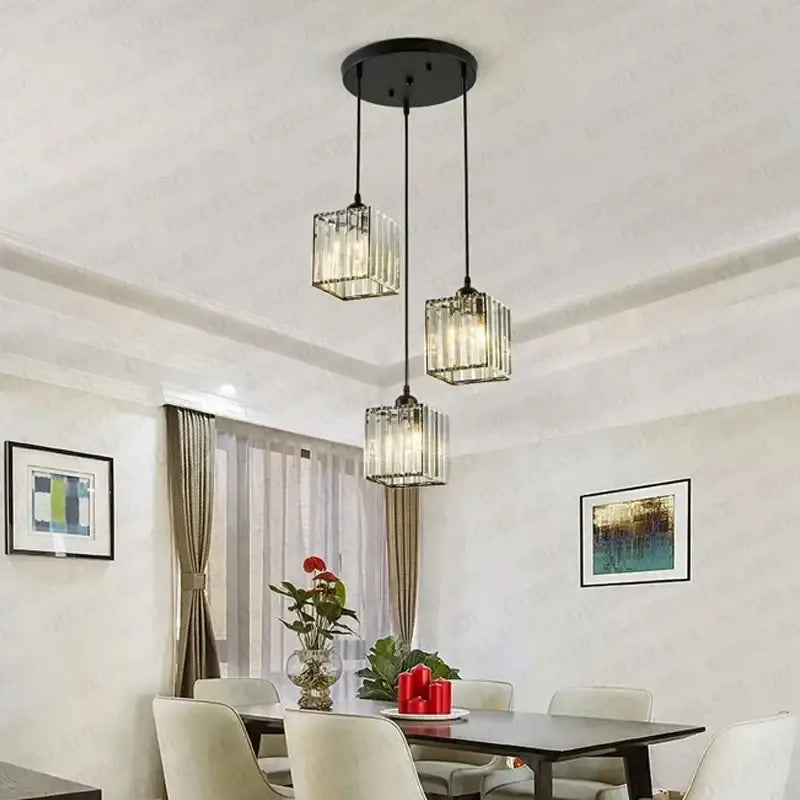 Modern bronze crystal trio pendant light with black metal and clear faceted glass cubes for dining room decorbites crystal trio