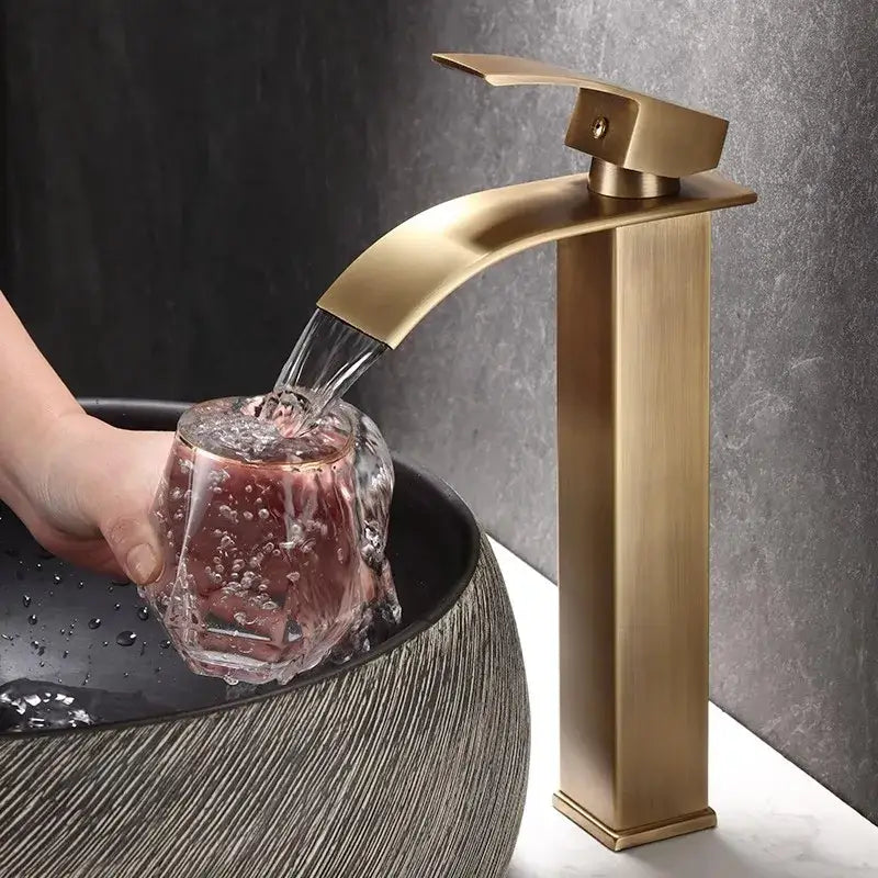 Modern bronze waterfall basin faucet with brass finish and sleek rectangular spout for bathroom sink decorbites bronze basin