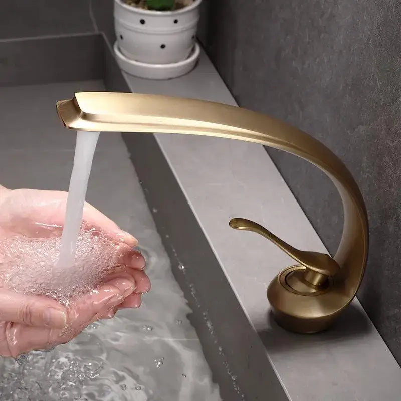 Brass-finished decorbites bronze waterfall bathroom faucet with sleek curved design for hot and cold basin use