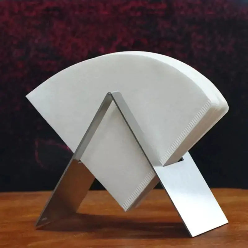 Modern brown coffee filter holder with sleek metallic filter holder stand holding white decorbites coffee filters