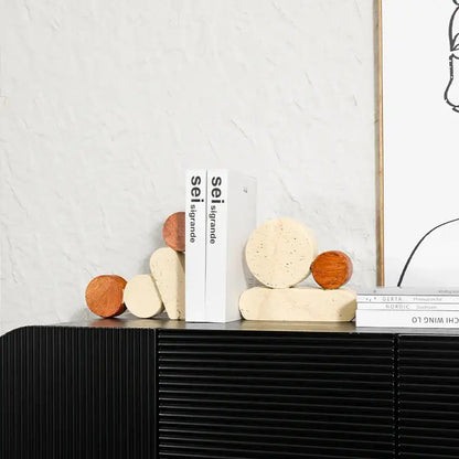 Cream-colored speckled geometric circle resin bookends with smooth rounded edges and matte finish for living room decorbites