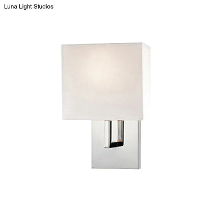 Modern brown fabric wall mount sconce with frosted white shade and polished chrome base for bedroom lighting