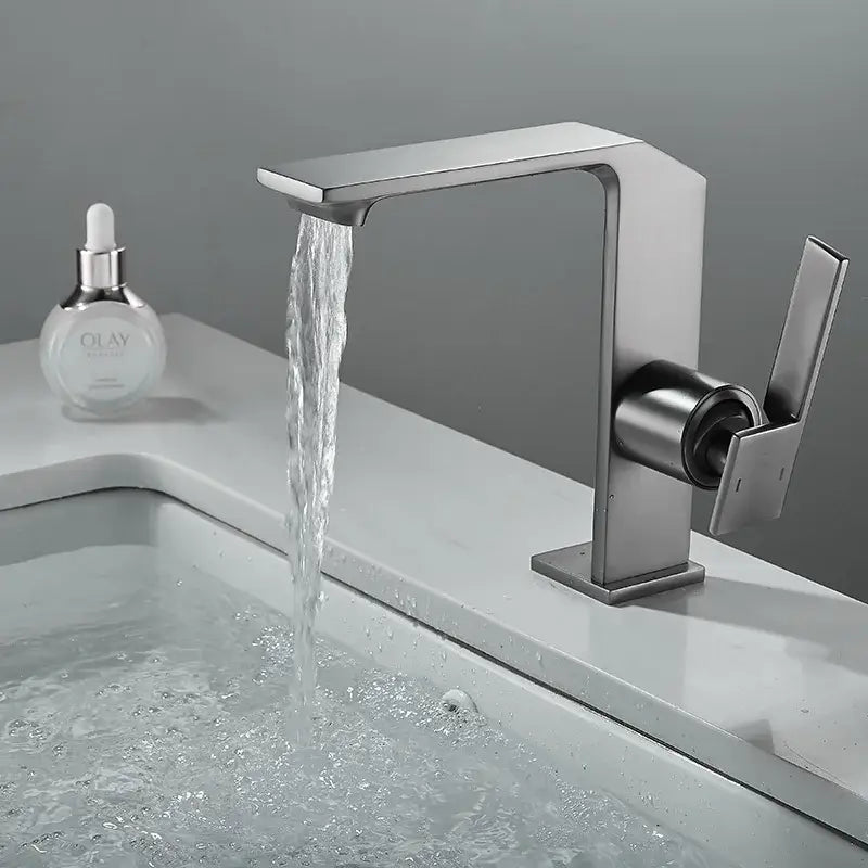 Modern brush gold basin faucet with sleek angular design and waterfall spout by decorbites brush gold collection