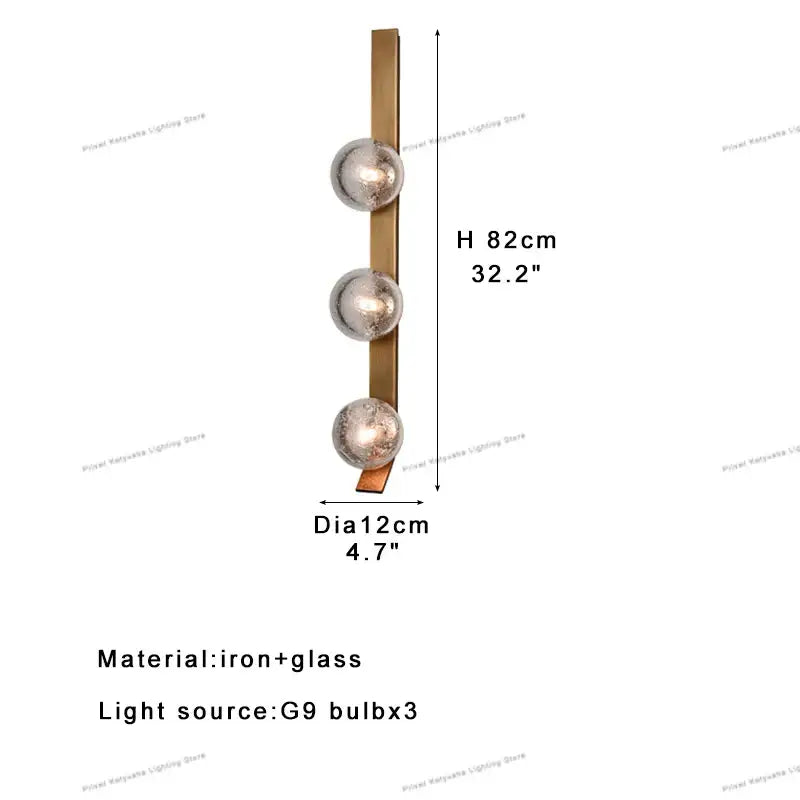 Modern brushed brass wall sconce lamps with three frosted glass globes ideal for bedroom lighting