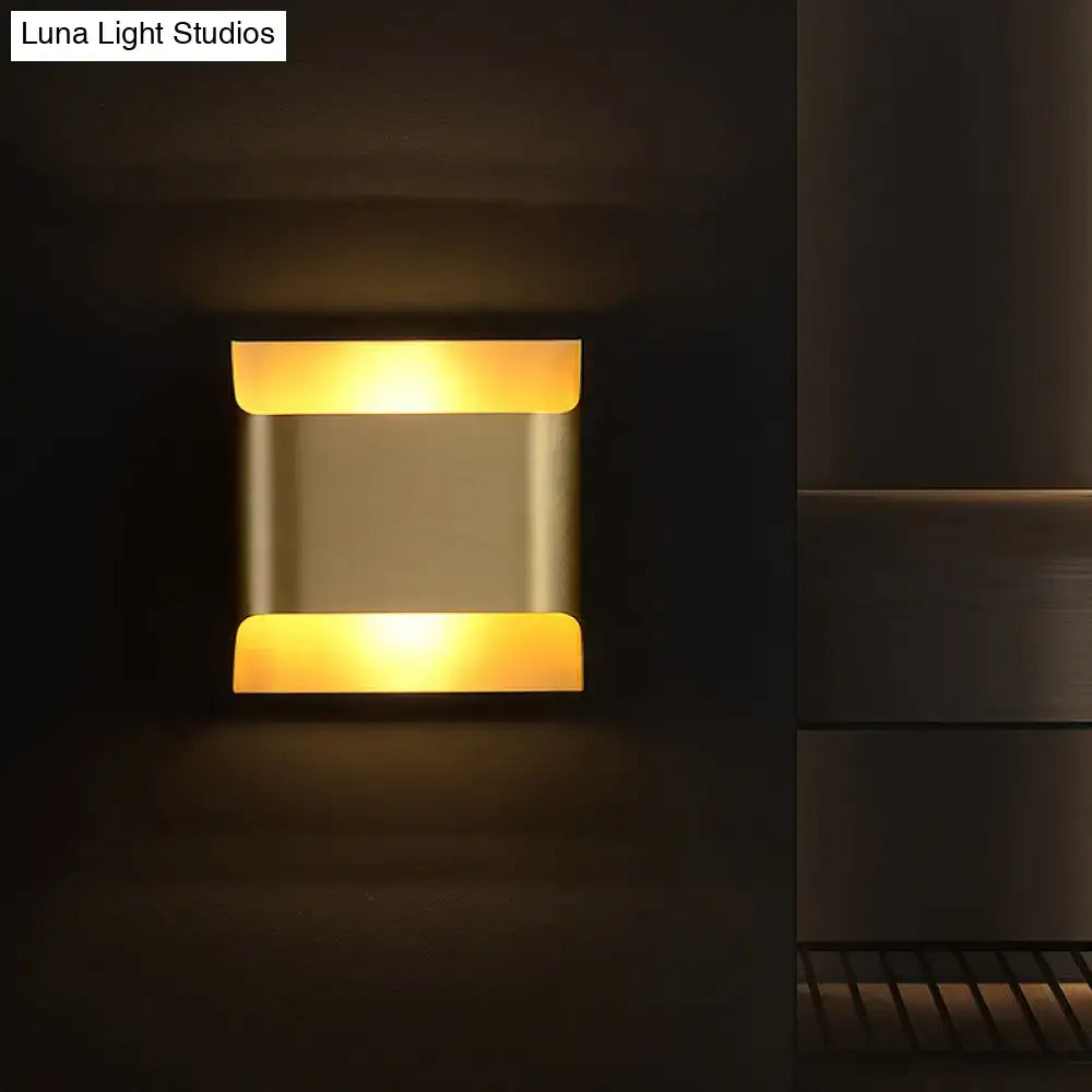 Modern brushed brass flush wall sconce with sleek metallic finish and warm amber lighting for stairwell wall light
