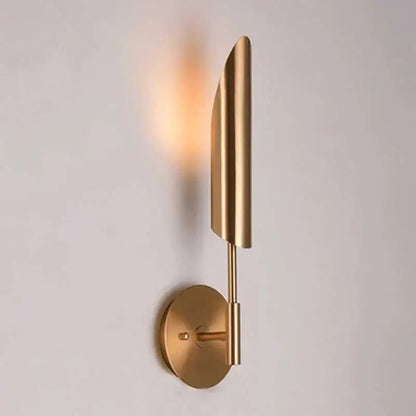 Modern brushed brass golden wall lamp with a gold-toned leaf-shaped shade and circular base for luxury decorbites golden wall lamp