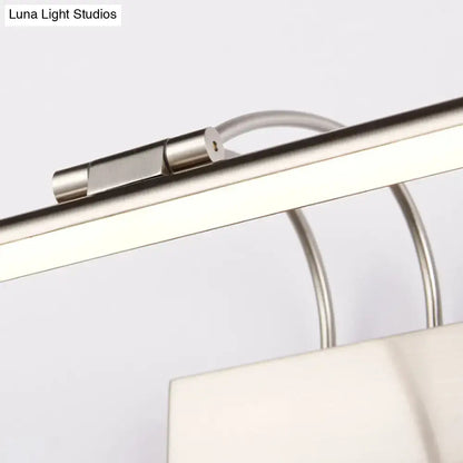 Modern brushed brass led wall light with sleek cylindrical connector and curved metallic support arms for bathroom use