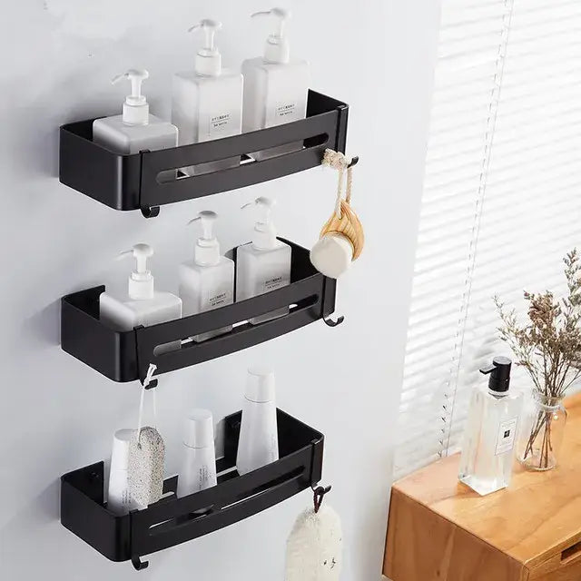 Black metal wall-mounted three tier corner shelf with white pump bottles and hooks for decorbites brushed gold aluminum use