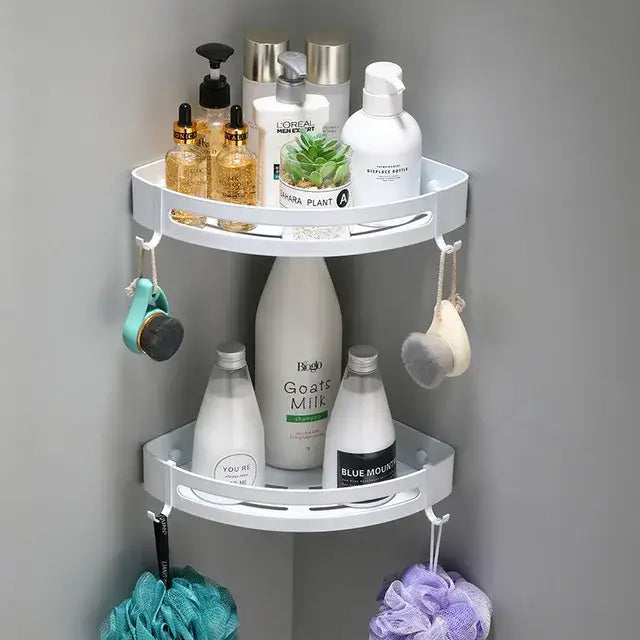 White two-tiered corner shelf caddy with hooks for bath accessories in decorbites brushed gold aluminum finish