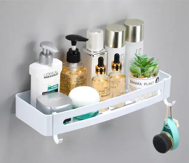 Modern brushed gold aluminum corner shelf with white plastic wall-mounted hooks and small plant pot decorbites brushed gold