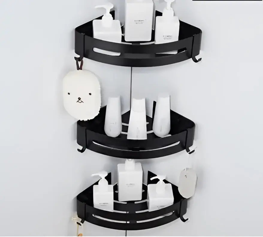 Black three-tiered corner shelf with curved metal shelves contrasting decorbites brushed gold aluminum design