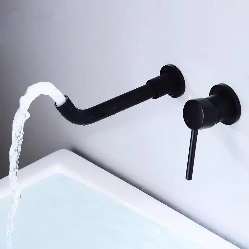 Modern brushed gold and black basin faucet set featuring a black matte wall-mounted curved spout and cylindrical handle faucet