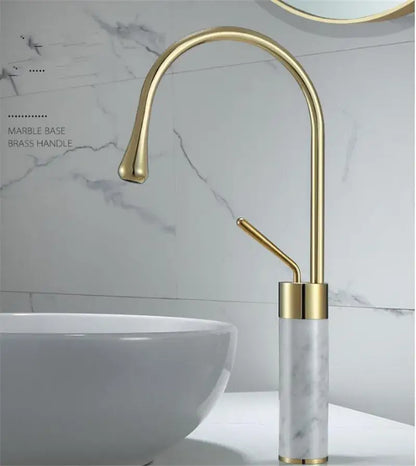 Modern brushed gold bathroom sink faucet with gold brass curved spout and marble base in brushed gold brass finish