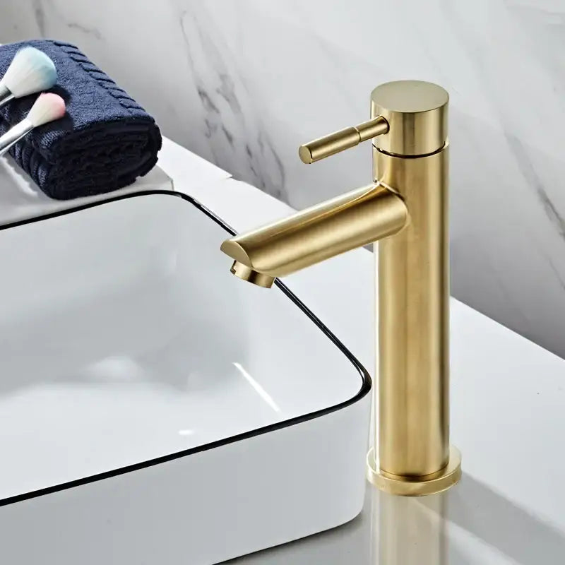 Modern brushed gold basin faucet with sleek cylindrical design and brushed metal finish by decorbites brushed gold